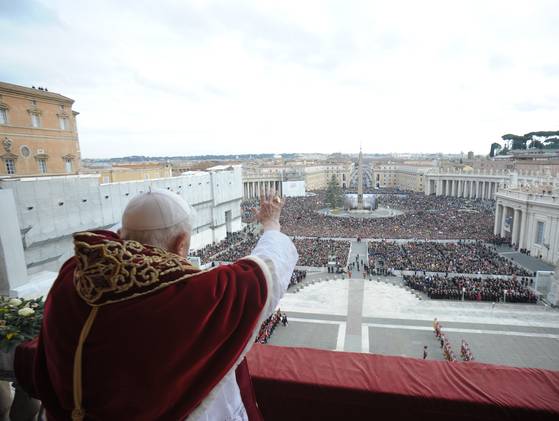 Pope Benedict XVI delivering the Vatican's traditional Christmas Day "Urbi et Orbi"(to the City and to the World) Message from the central balcony of Saint Peter's Basilica on Tuesday, December 25, 2012.