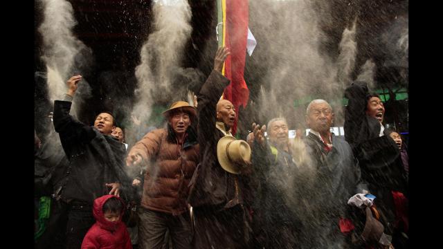 WHAT IS TIBET'S FUTURE? EXILED TIBETANS CELEBRATING TIBETAN NEW YEAR "LOSAR" AT TSUGLAGKHANG TEMPLE. GREET EACH OTHER "TASHI DELEK."