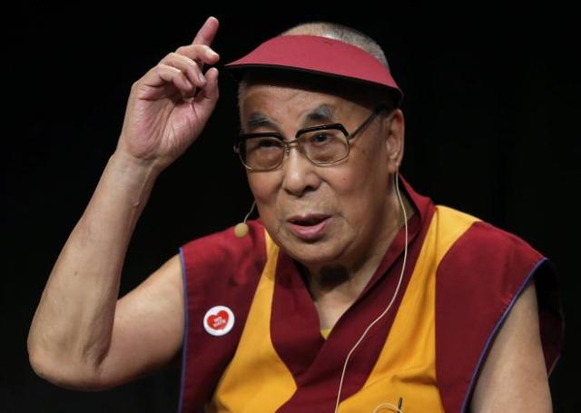 Tibet's exiled spiritual leader the Dalai Lama gestures as he attends a meeting with youth in Strasbourg, France, September 15, 2016. REUTERS/Vincent Kessler