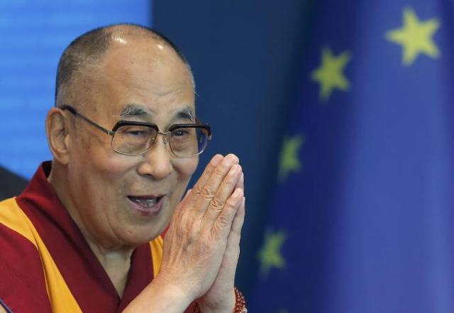 Tibet's exiled spiritual leader the Dalai Lama gestures as he arrives to deliver a speech at the Council of Europe in Strasbourg, France, September 15, 2016. REUTERS/Vincent Kessler