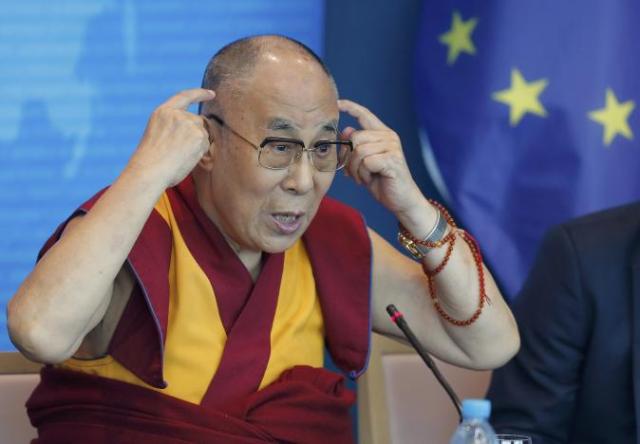 Tibet's exiled spiritual leader the Dalai Lama gestures as he delivers a speech at the Council of Europe in Strasbourg, France, September 15, 2016. REUTERS/Vincent Kessler