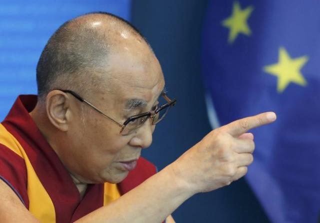 Tibet's exiled spiritual leader the Dalai Lama gestures as he delivers a speech at the Council of Europe in Strasbourg, France, September 15, 2016. REUTERS/Vincent Kessler