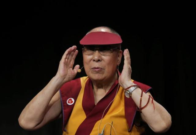 Tibet's exiled spiritual leader the Dalai Lama gestures as he attends a meeting with youth in Strasbourg, France, September 15, 2016. REUTERS/Vincent Kessler