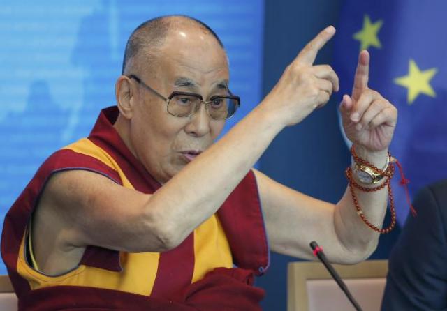Tibet's exiled spiritual leader the Dalai Lama gestures as he delivers a speech at the Council of Europe in Strasbourg, France, September 15, 2016. REUTERS/Vincent Kessler